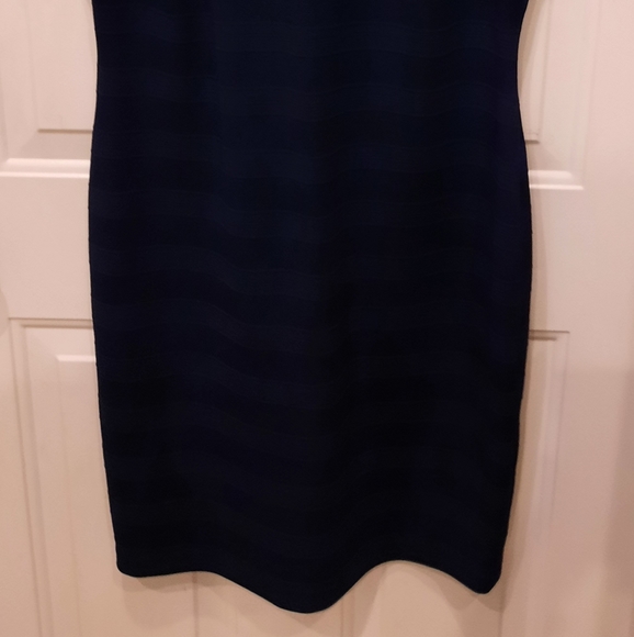 Navy blue dress, there's a pull in the material that can be tucked into fabric. - Picture 2 of 5